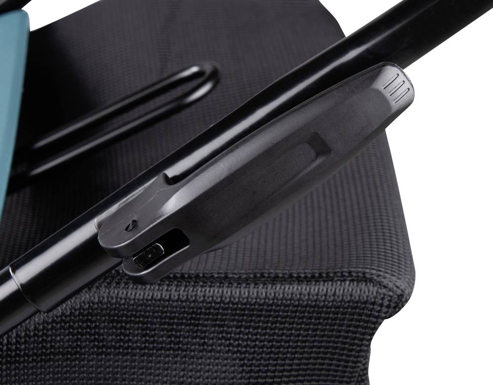 Close-up van een zwarte greep aan een zwart voorwerp voor een gestructureerde achtergrond.