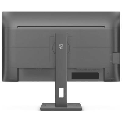 Achterkant van een computer met een grijze monitor op een standaard. Geen zichtbare scherminhoud.