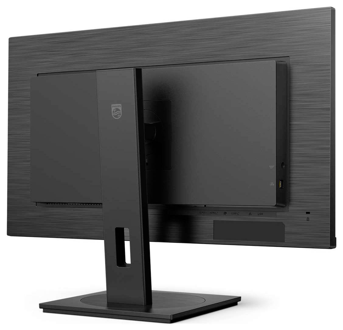Een zwarte computermonitor van achteren gezien, gemonteerd op een rechthoekige standaard, met een gestructureerde behuizing en kabelaansluitingen.