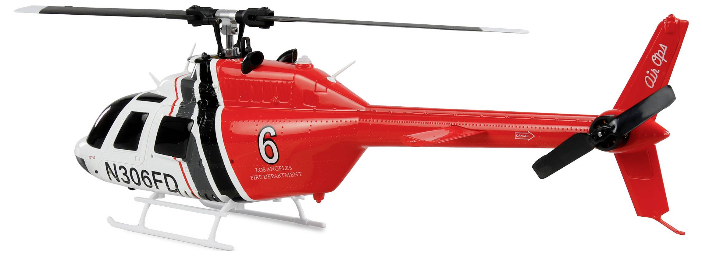 Een rood-wit speelgoed-helikoptermodel in brandweerdesign met de tekst 'Air Ops' op de staartrotor.