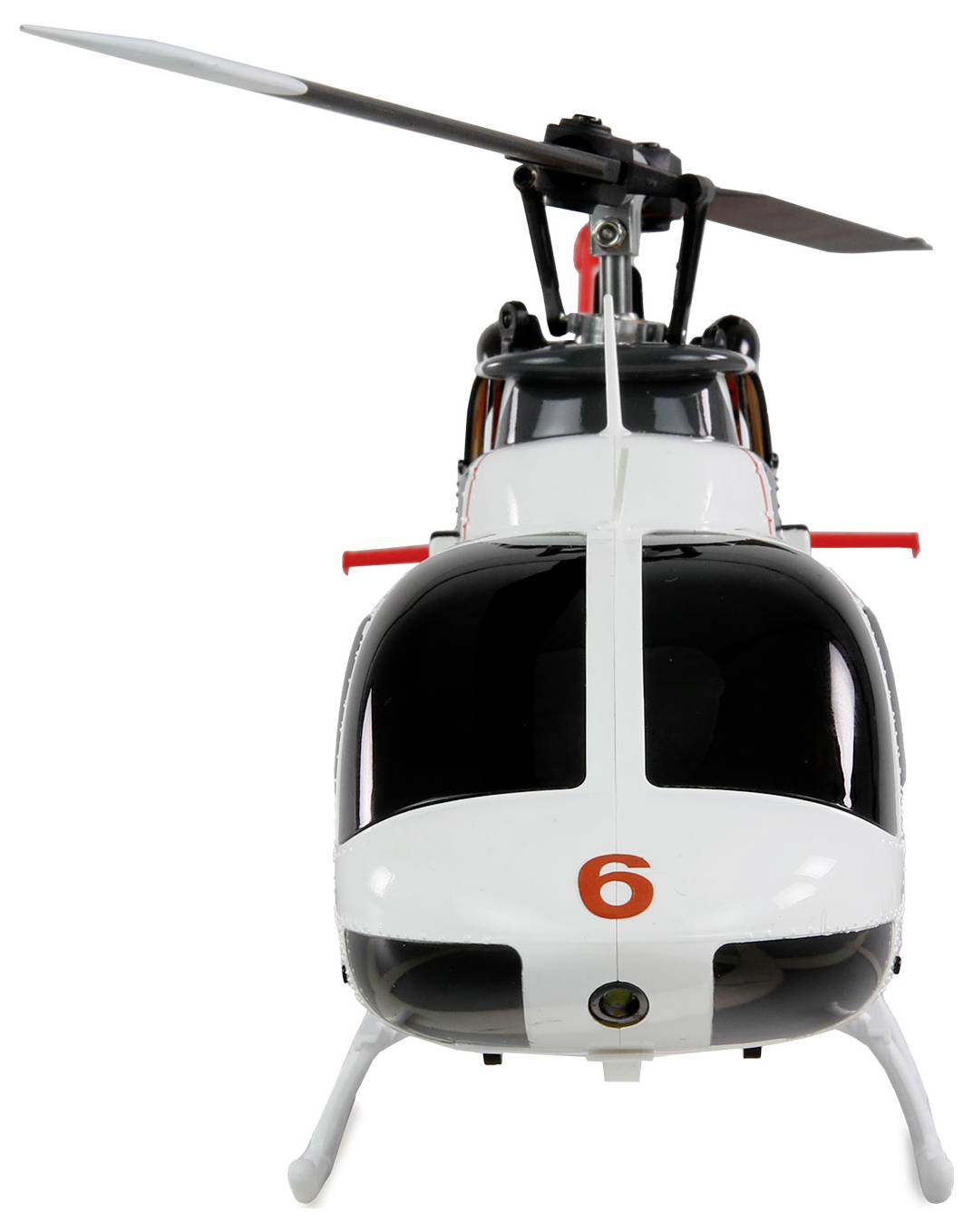 Een zwart-witte speelgoed-helikopter met het rode nummer '6' aan de voorkant voor een witte achtergrond.