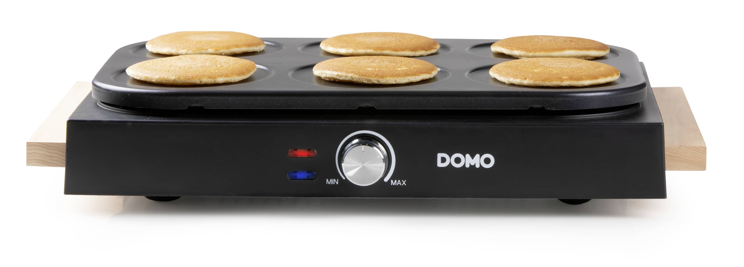 Zwarte elektrische crêpemaker met zes ronde crêpes op het bakoppervlak, regelaar toont 'MIN' tot 'MAX', merk 'DOMO'.