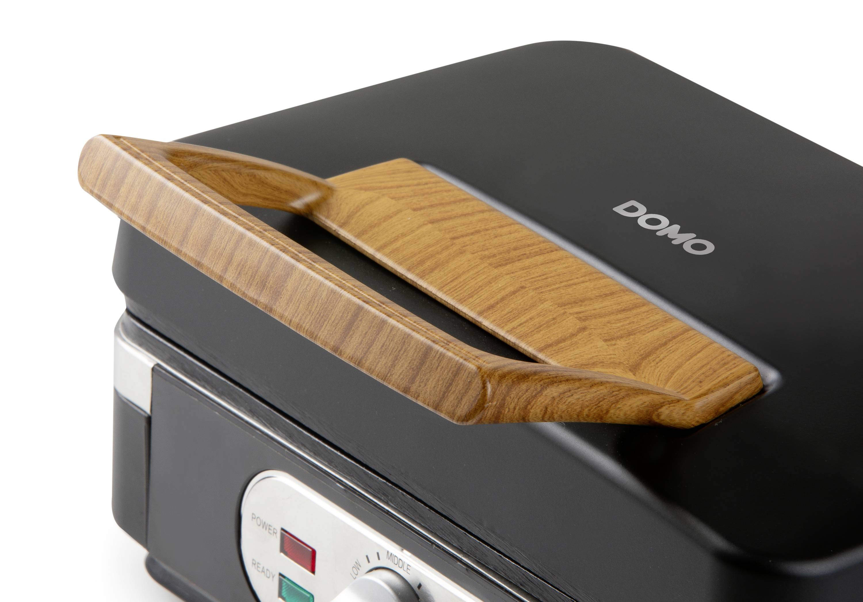Keukentoestelapparaat met een donkergrijze oppervlakte en houten handgreep. Merknaam 'DOMO' zichtbaar. Temperatuurregelaar met rode en groene lampjes.