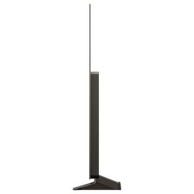 Zijaanzicht van een ultra-dunne, moderne flatscreen televisie op een driehoekige standaard, die het strakke en minimalistische ontwerp demonstreert.