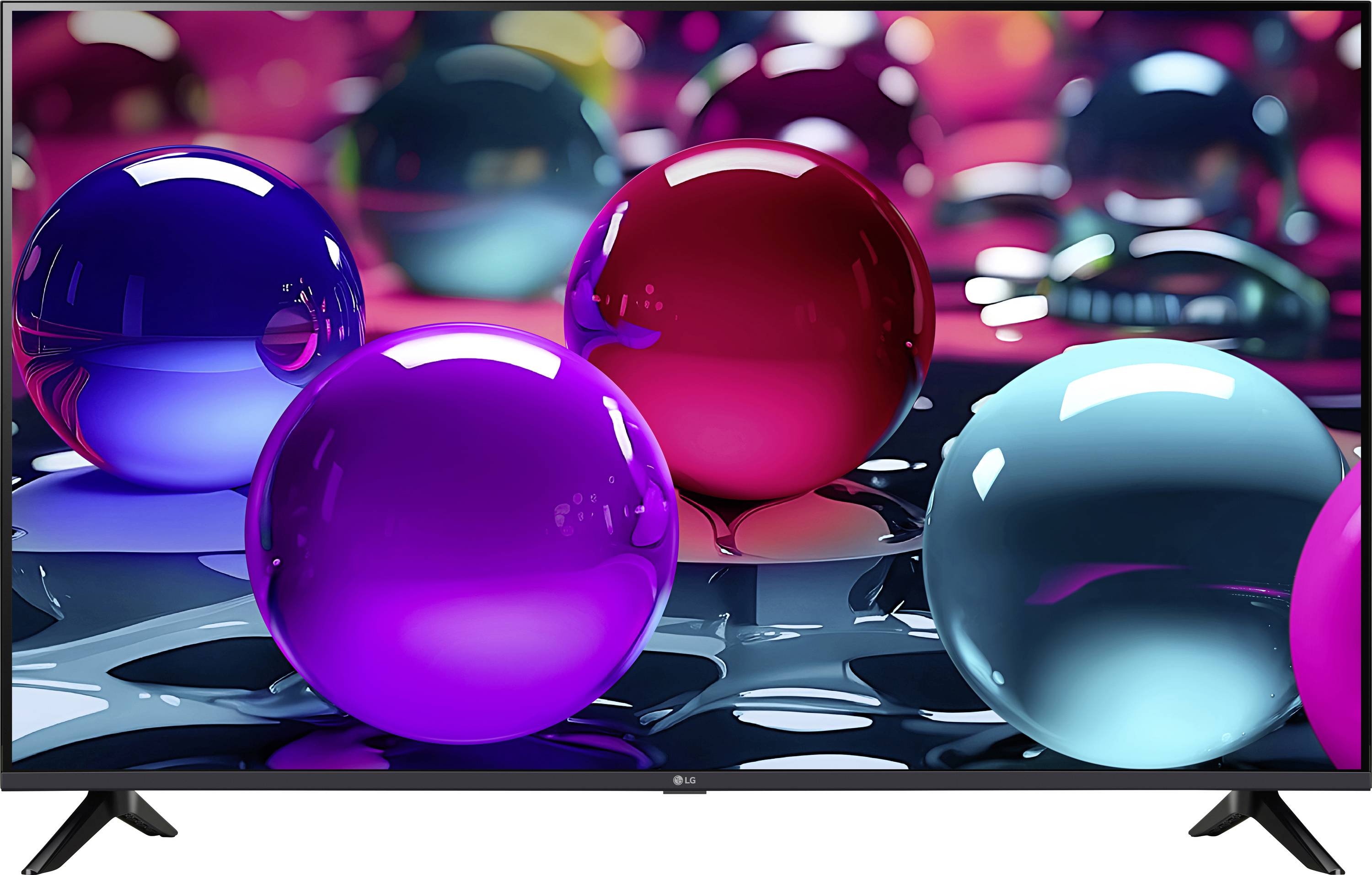 Kleurrijke doorschijnende bollen op een reflecterende oppervlakte vormen een abstract patroon met levendige rode, blauwe en paarse tinten, wat een vrolijke en speelse sfeer oproept.