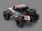 Speelgoed terreinwagen met opschrift 'Reckless Racing', oranje-blauwe ontwerp, grote banden, reservewiel gemonteerd aan de achterkant.