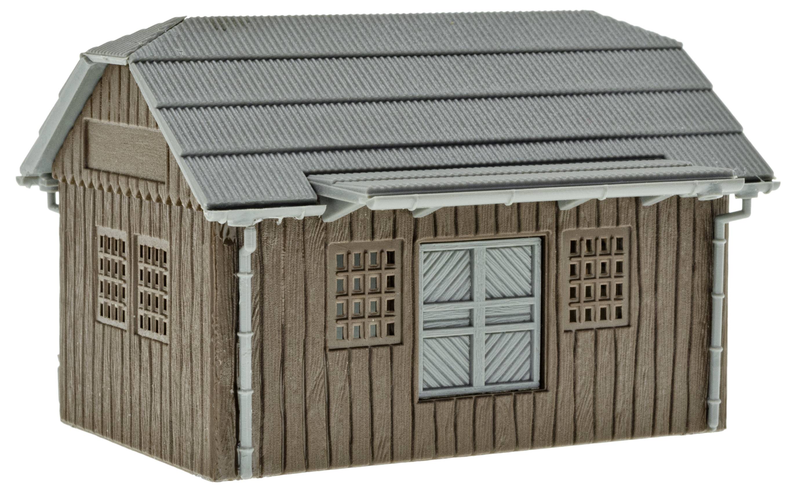 Grijs, klein model van een houten schuur met een hellend dak en ramen aan de zijkant. Geschikt voor modelbouw-diorama's.