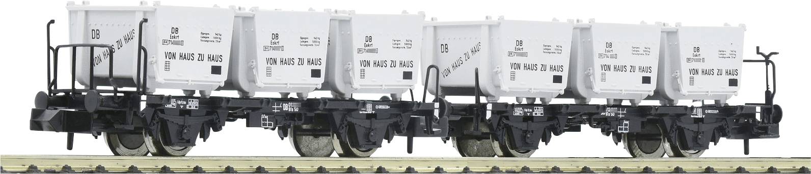 Een goederenwagen met zes witte containers, gemarkeerd met '100 jaar VTG Pauls', staat op een spoor. Transportgerelateerd.