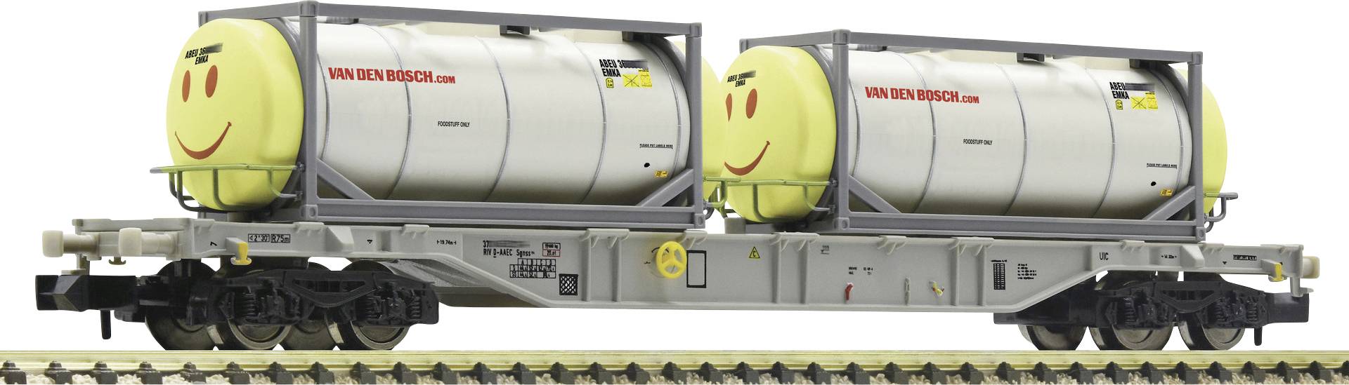 Twee ketelbakwagens met lachende gezichten op een spoorrails, met het opschrift 'VAN DEN BOSCH'. Ze staan op sporen.