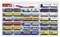 Een set van 32 miniatuur vrachtwagens in verschillende kleuren en ontwerpen, gerangschikt in vier rijen. Bevat merklogo's en verschillende laadvormen.
