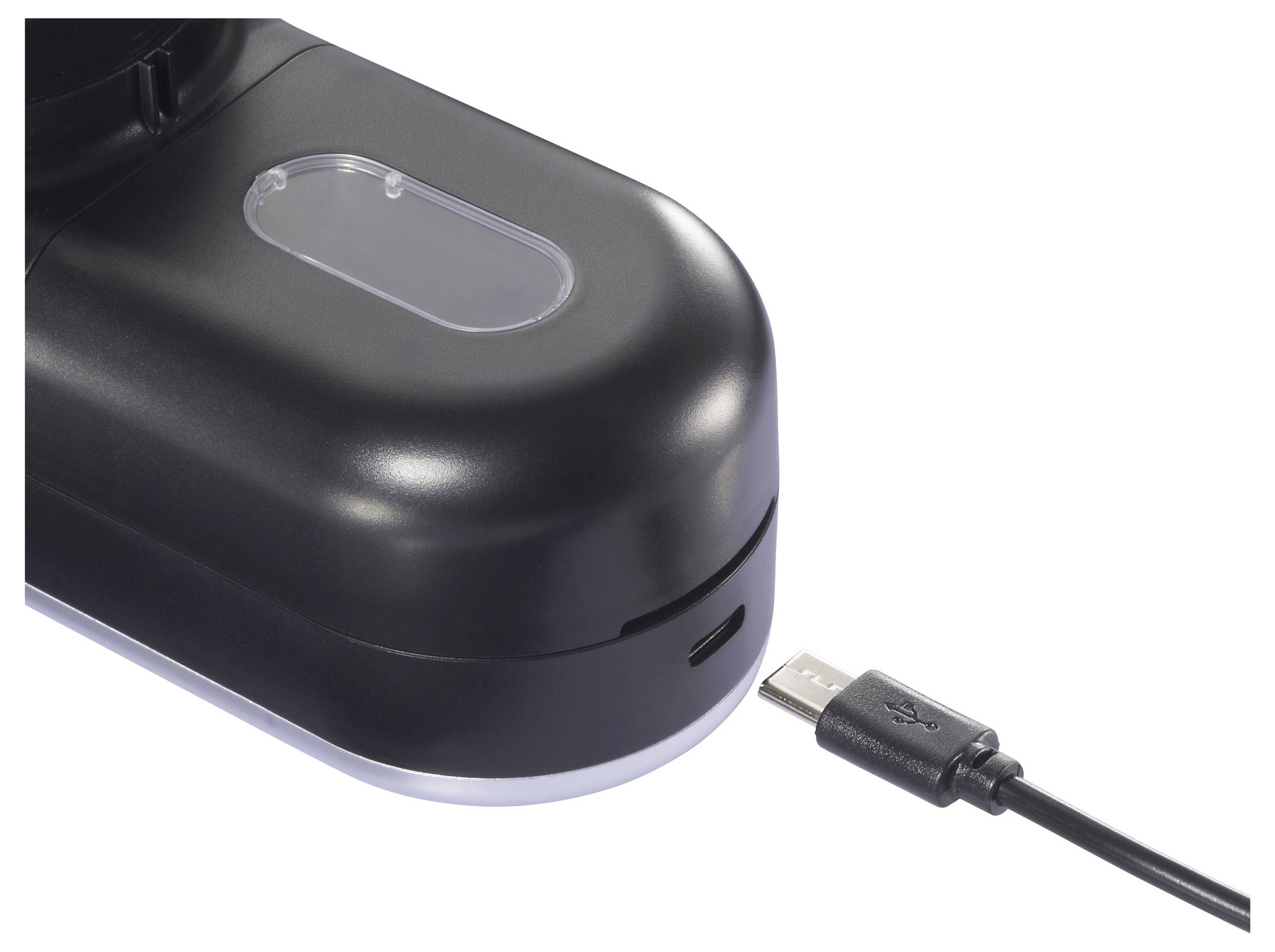 Een zwart elektronisch apparaat heeft een transparante sectie aan de bovenkant. Ernaast ligt een USB-kabel, gepositioneerd om in het apparaat te worden gestoken.