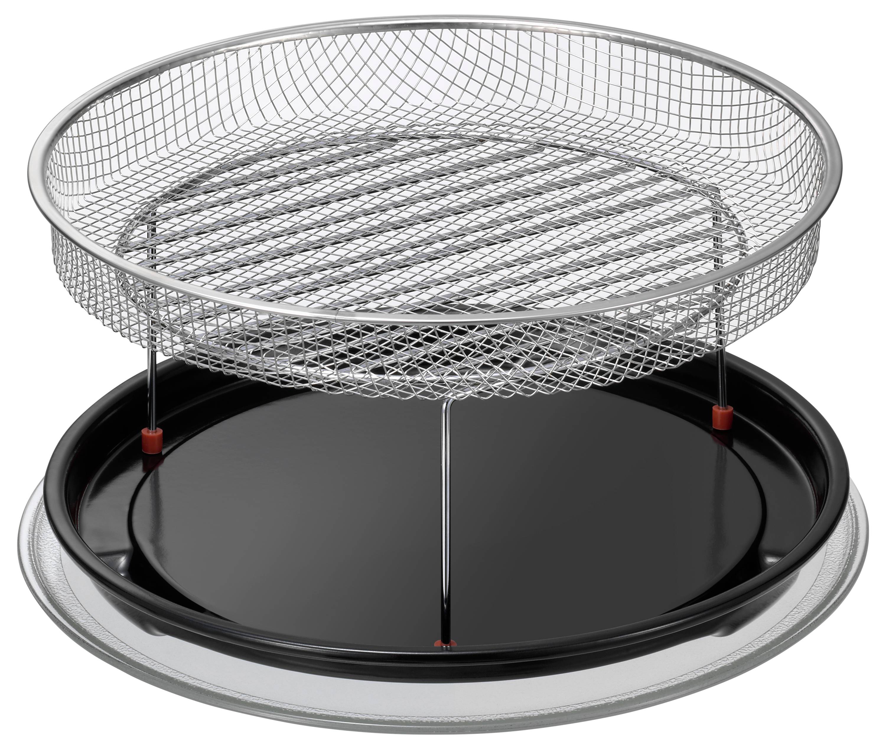 Een ronde, zilveren metalen barbecue met een platte rooster en een zwarte, verwijderbare bodem, geplaatst op een tafel.