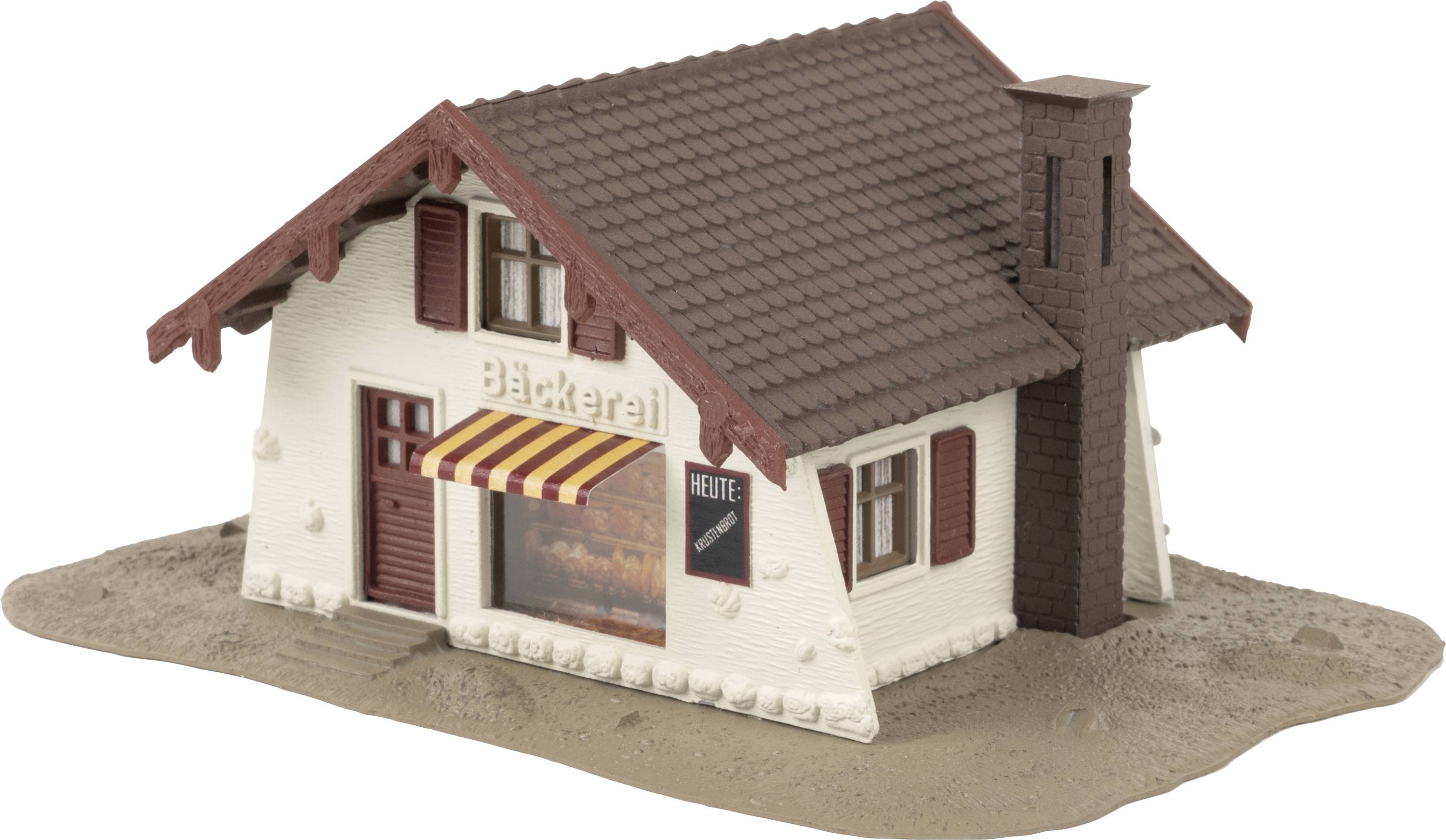 Een maquette van een klein gebouw met het opschrift 'Bakkerij' en een bord 'Vandaag' naast een rode luik.