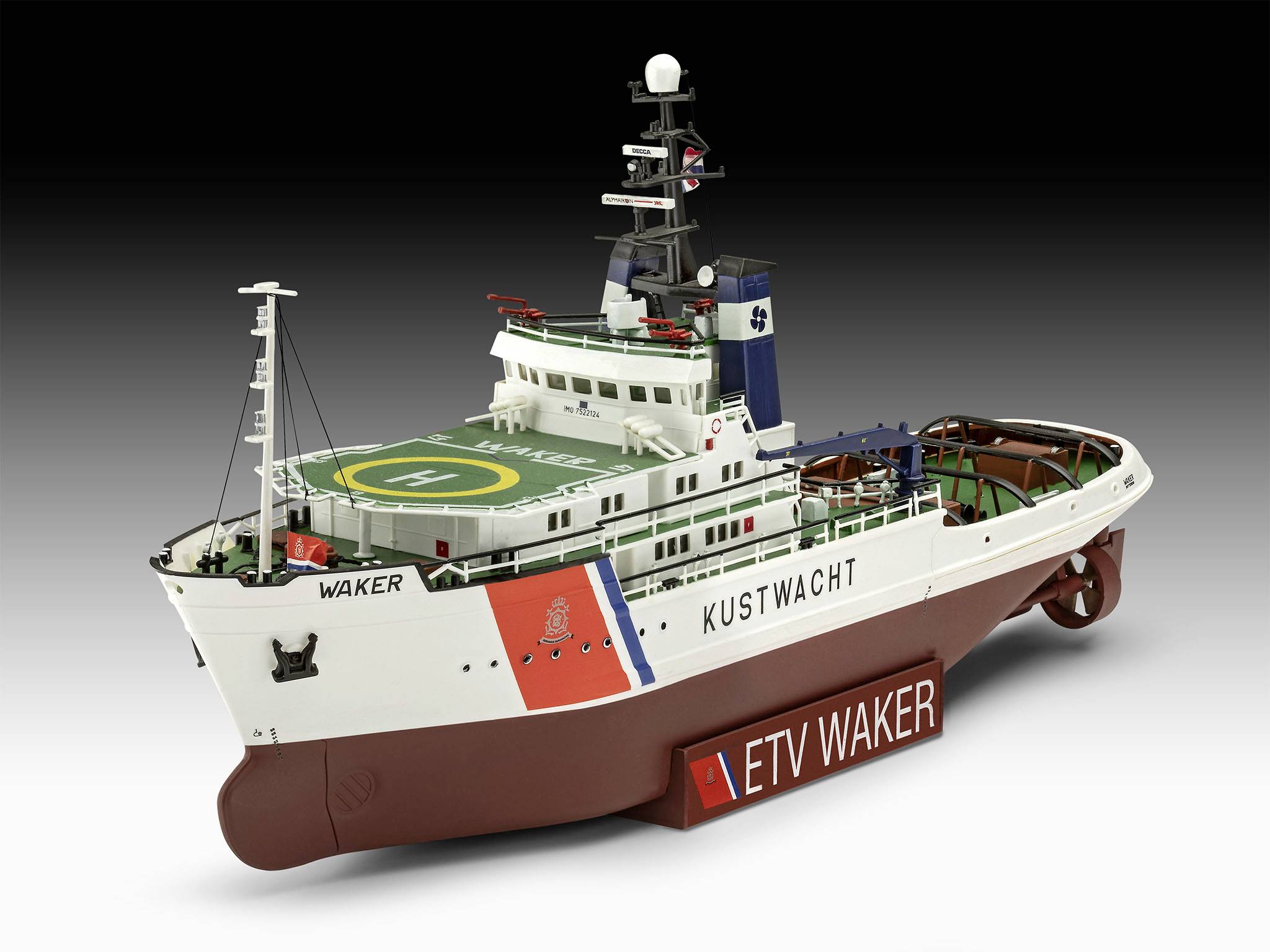 Een modelschip met het opschrift 'KUSTWACHT' en 'ETV WAKER' aan de zijkant. Het heeft een helikopterdek en radioantennen.