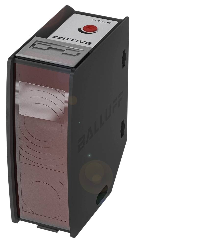 Een zwarte rechthoekige sensor met rood lichtvenster, opschrift 'BALLUFF' bovenaan, rode knop en markering op wit bordje.