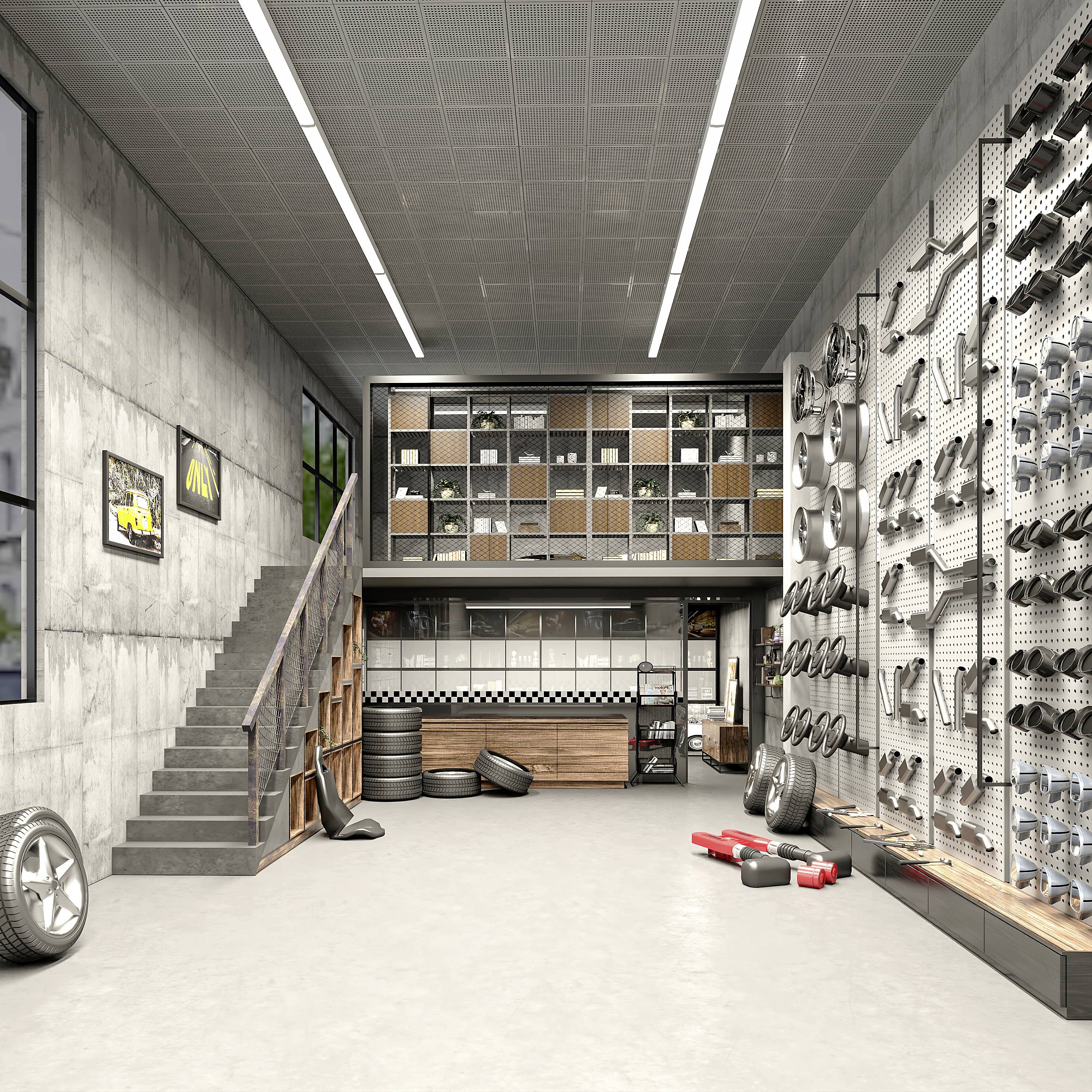 Een moderne werkplaats met schappen vol auto-onderdelen, stapels banden rechts, een trap leidt naar een klein kantoor. Grijze muren, heldere verlichting.