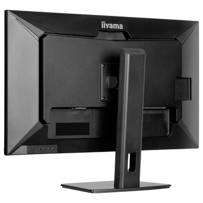 Een zwarte computermonitor gezien van achteren, waarbij de standaard en aansluitpoorten zichtbaar zijn.
