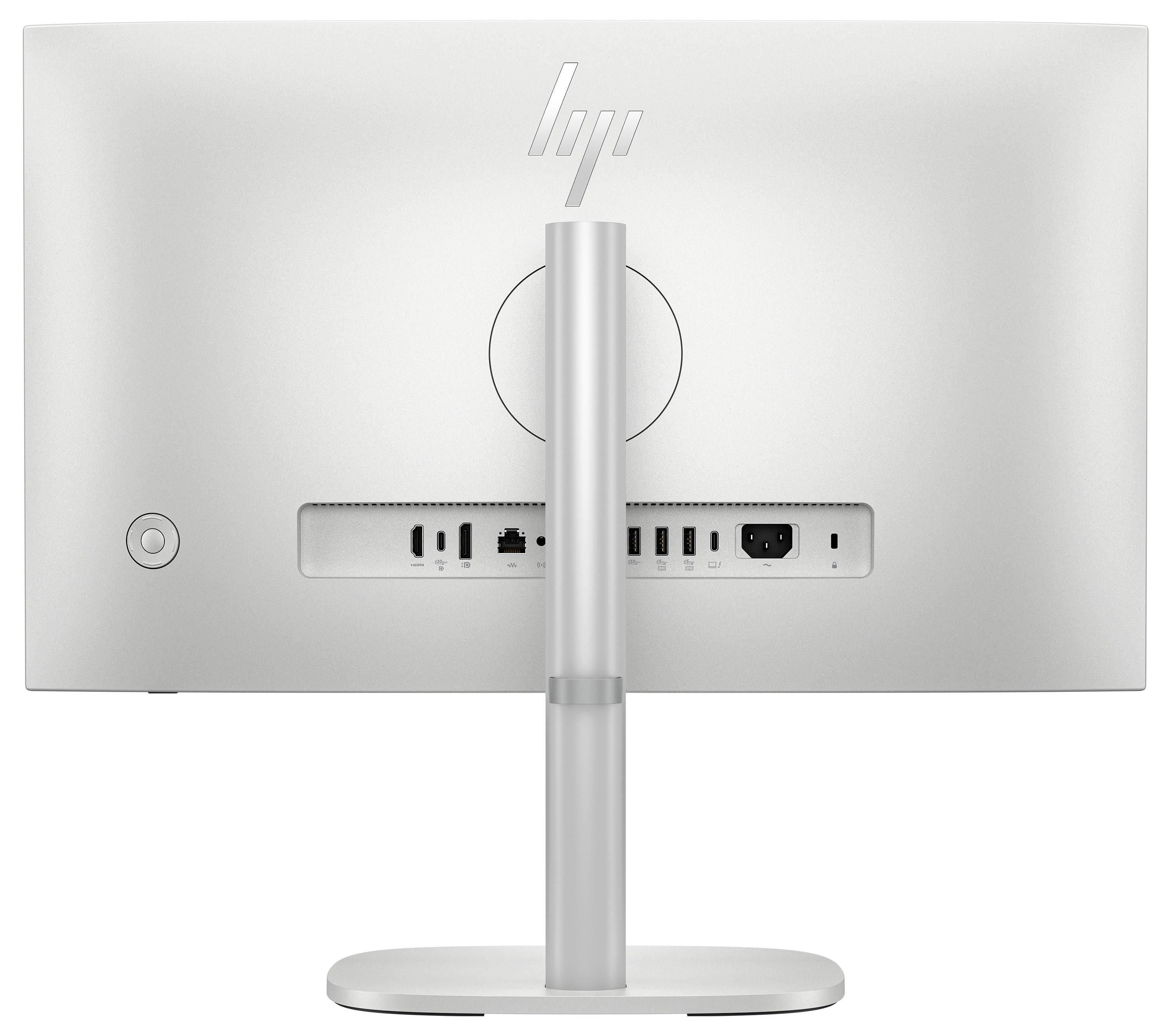 Het beeld toont de achteraanzicht van een witte computermonitor met een standaard. Verschillende poorten, waaronder USB en HDMI, zijn zichtbaar.