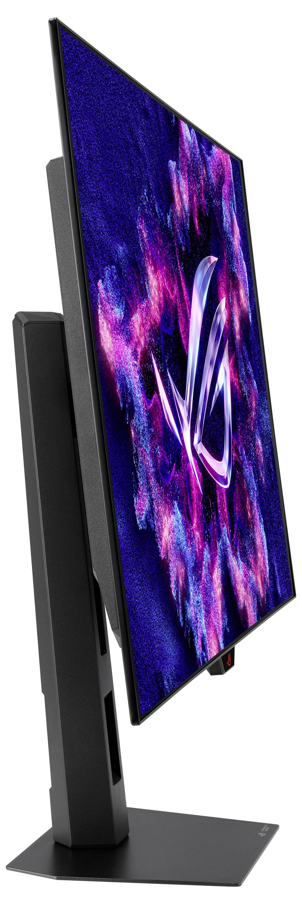 Een strak, modern computerscherm met een levendige, abstracte weergave van roze en blauwe kleuren, bekeken van opzij op een stevig voetstuk.