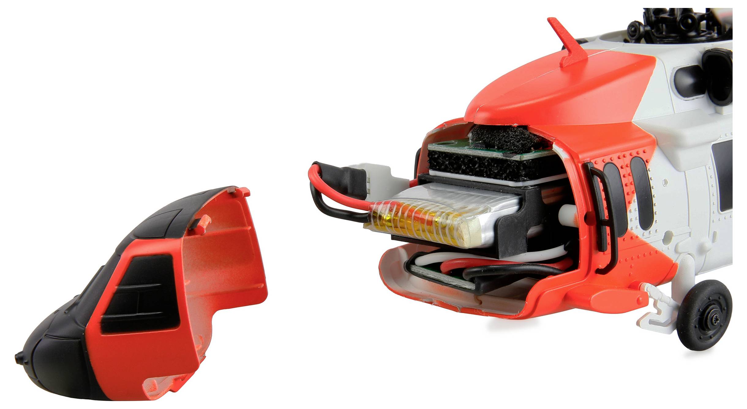 Een speelgoed-helikopter met een open neusvak waarbij de interne elektronica en batterij zichtbaar zijn, naast de verwijderde neuskap.
