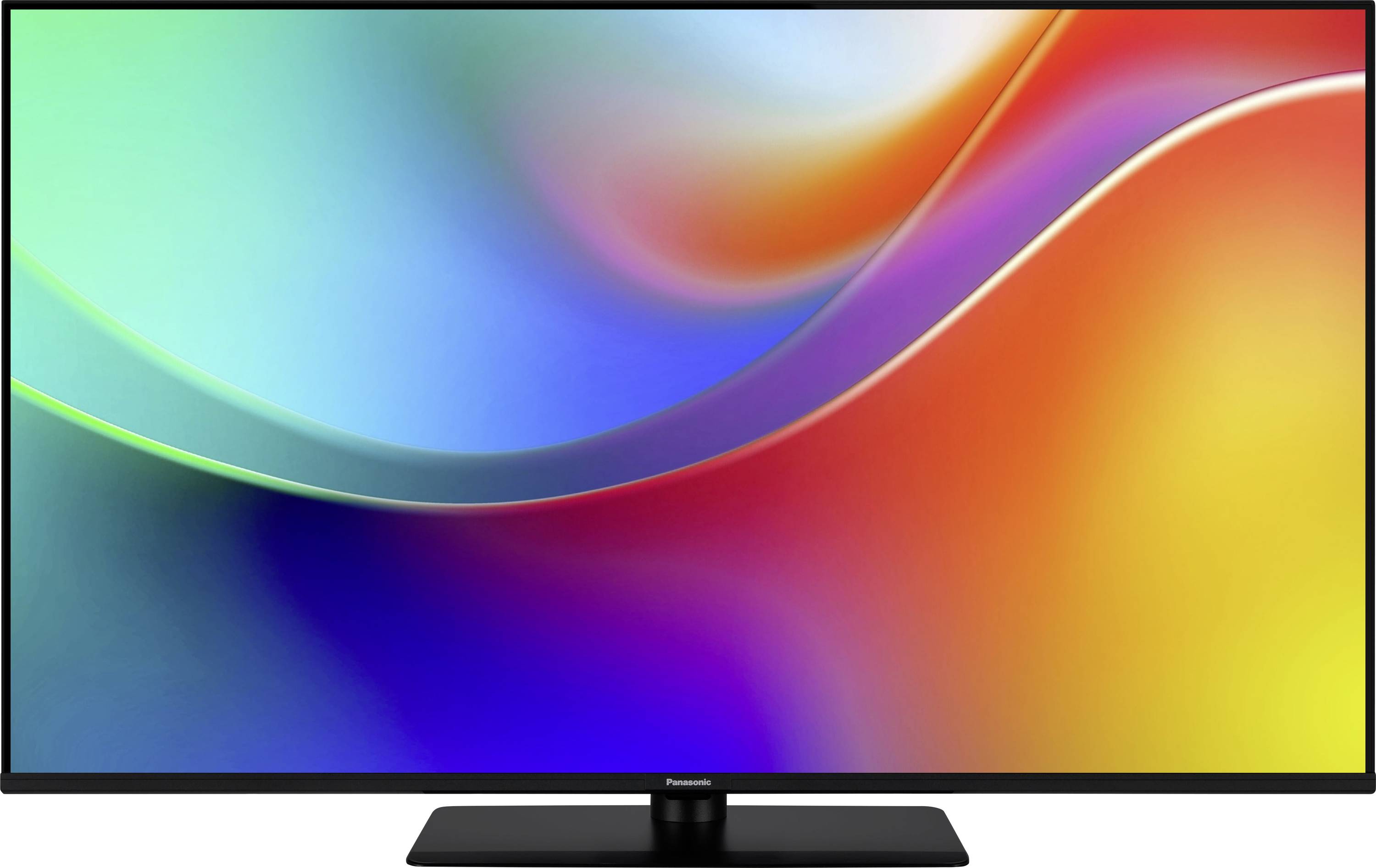 Een flatscreen-tv waarop een levendig abstract beeld wordt vertoond met draaiende kleuren blauw, groen, rood en oranje op het scherm.