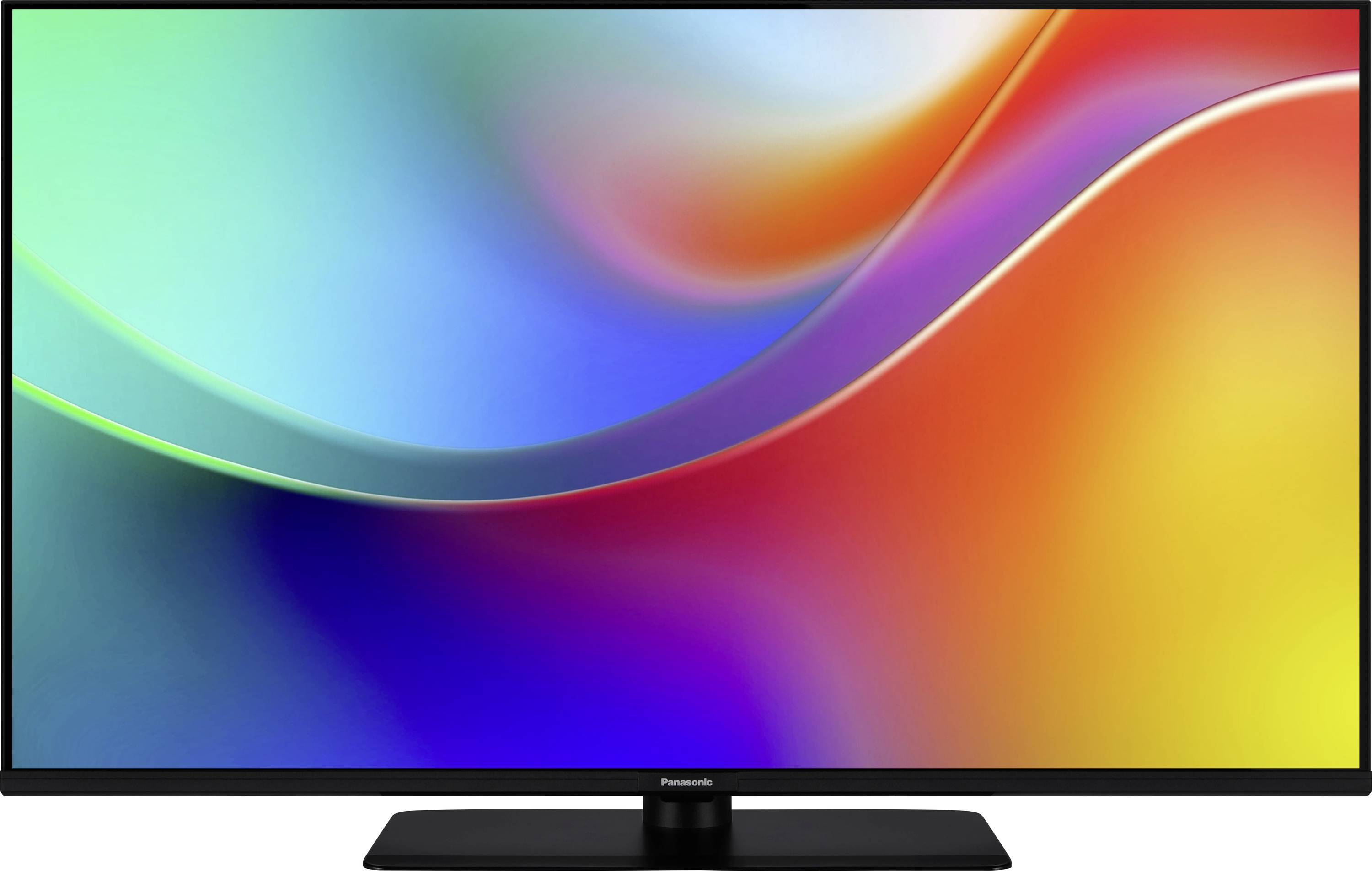 Een strakke moderne televisie met een levendig abstract kleurrijk scherm dat een verloop van blauwe, groene, rode en gele tinten laat zien.