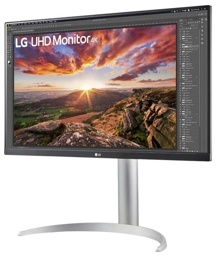 Een computermonitor toont een levendig landschap met felle kleuren tijdens zonsondergang. Op het scherm staat 'LG UHD Monitor 4K'.