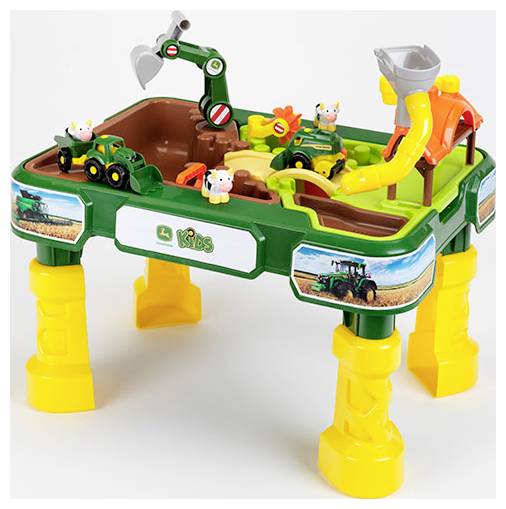 Kinderspeeltafel met boerderijthema, voorzien van een speelgoedtractor, dieren en een gele glijbaan. De tafel is groen met gele poten.