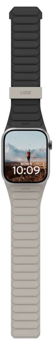 Een smartwatch waarop '10:09' wordt weergegeven, met een persoon die staat op een bergachtergrond. Hij heeft een zwarte en beige band.