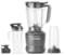 Een zwarte NutriBullet blender set met een hoofdbasis, grote blenderbeker, to-go beker met deksel en een extra kleine beker, allemaal op een witte achtergrond.