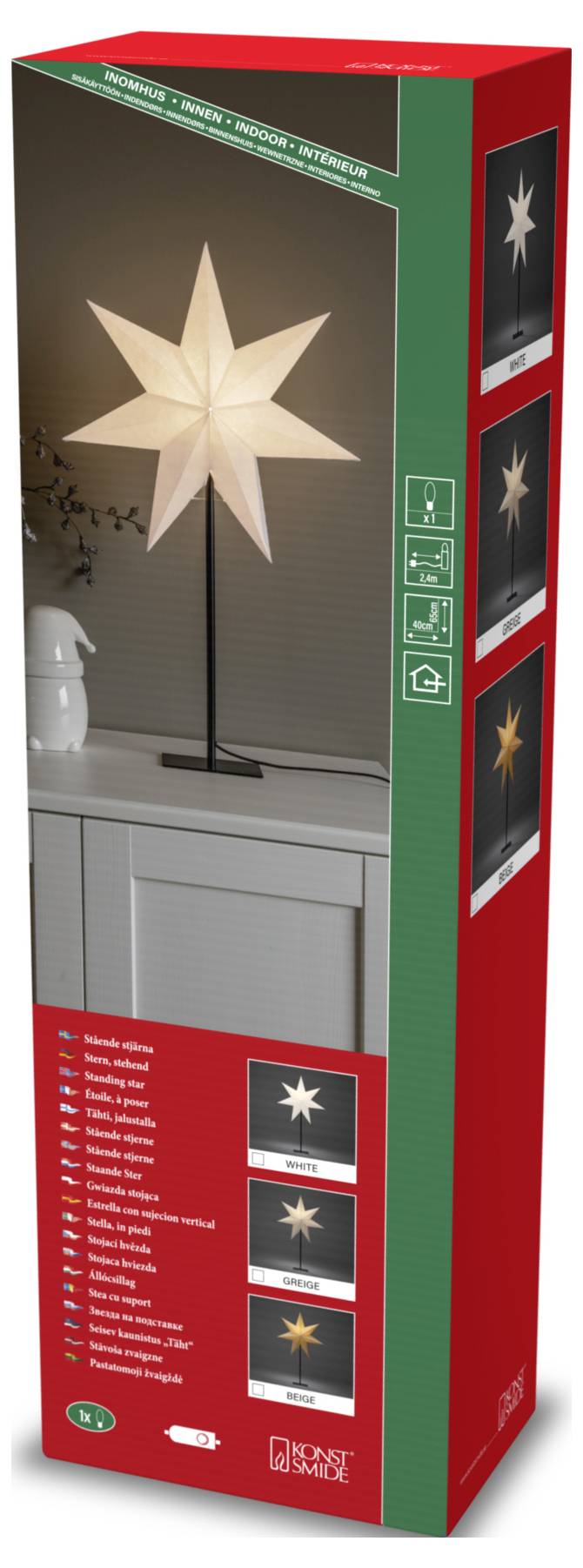Een hoge rode en groene doos met een foto van een verlichte stervormige lamp op een standaard, geplaatst op een plank. De doos toont de lamp vanuit verschillende hoeken.