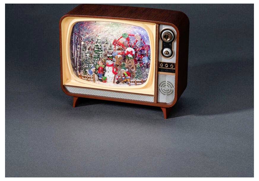 Een vintage televisie die een feestelijk wintertafereel vertoont met stripfiguren gekleed in feestelijke kledij tussen met sneeuw bedekte bomen.
