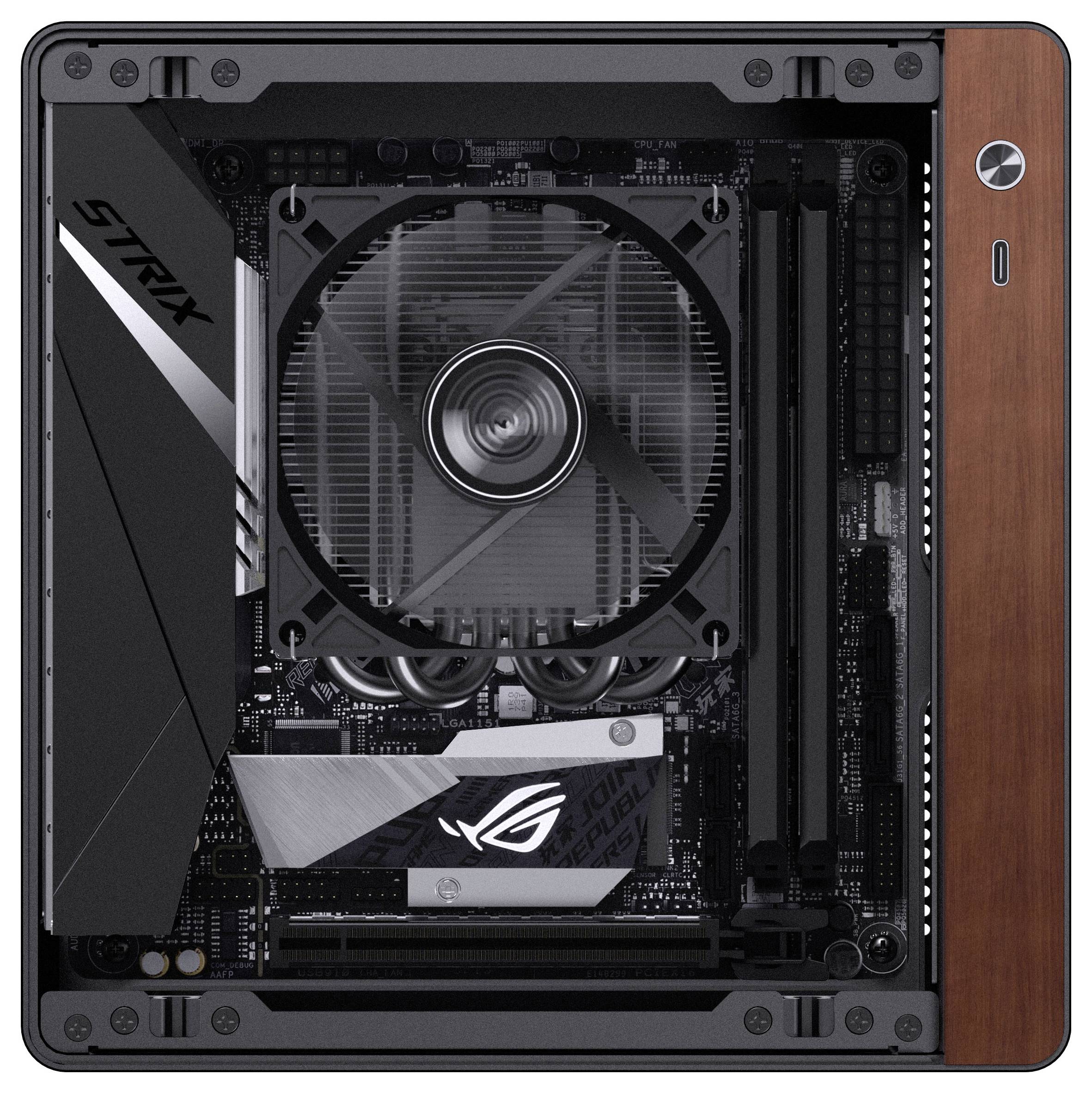 Een compacte computermoederbord met een grote ventilator in het midden, RAM-sleuven aan de rechterkant, en verschillende componenten, met een strak design.