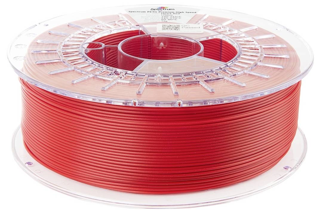 Een spoel met rode 3D-printerfilament, netjes opgerold op een transparante plastic haspel, gebruikt voor 3D-printprojecten.