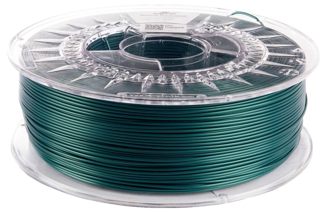 Een spoel groene 3D-printerdraad, netjes opgerold, liggend op zijn kant.