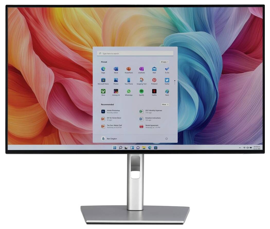 Een computermonitor toont een kleurrijke abstracte achtergrond met een geopend Start-menu waarop verschillende toepassingspictogrammen en een zoekbalk te zien zijn.