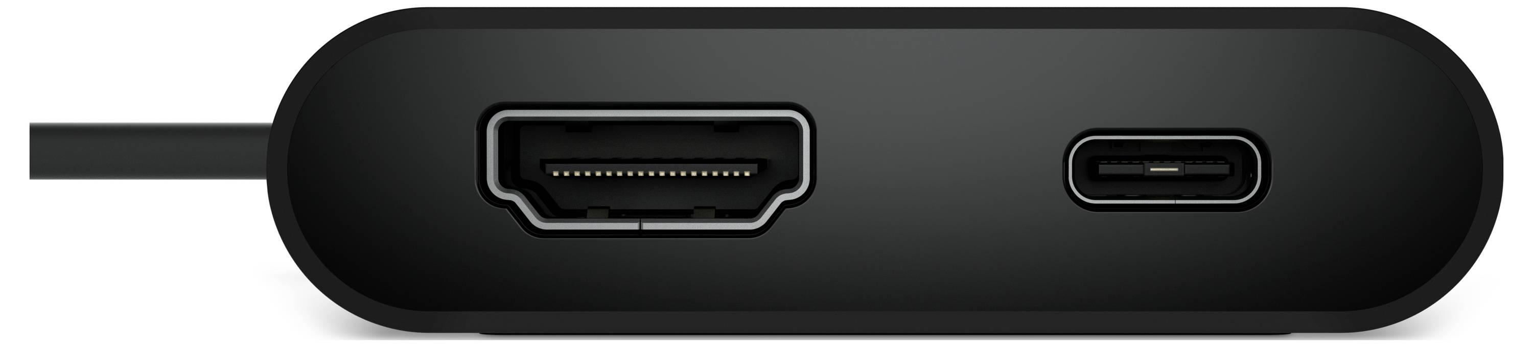 Een close-up van een zwart elektronisch apparaat met één HDMI-poort aan de linkerkant en één USB-C-poort aan de rechterkant.