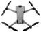 Een grijze quadcopter drone met vier uitgestoken propellers, met een compact ontwerp en een kleine camera aan de voorkant voor luchtfotografie.