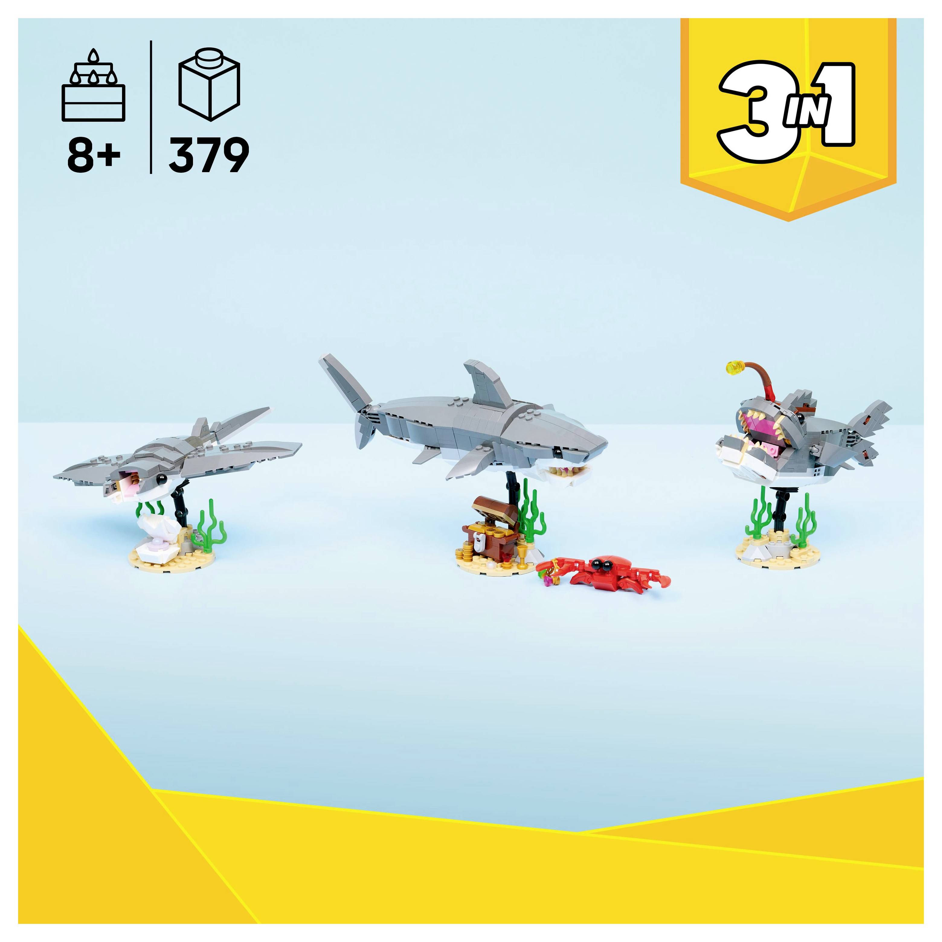 'Bouwspeelgoed met drie haaienmodellen en een onderwaterscène. Bevat verschillende onderdelen voor creatieve assemblage. Leeftijd 8+, 379 onderdelen.'