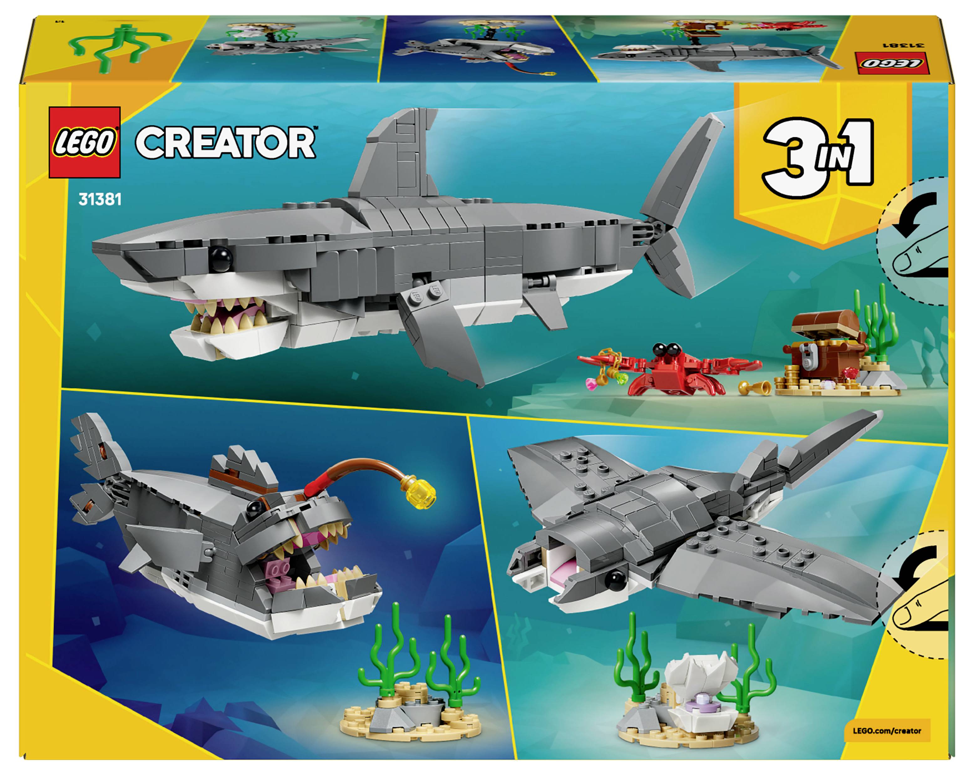 'Lego Creator 3-in-1 Haaiset doos met drie zeecreature-bouwwerken: haai, diepzeevissen en mantarog, met achtergrondscènes.'