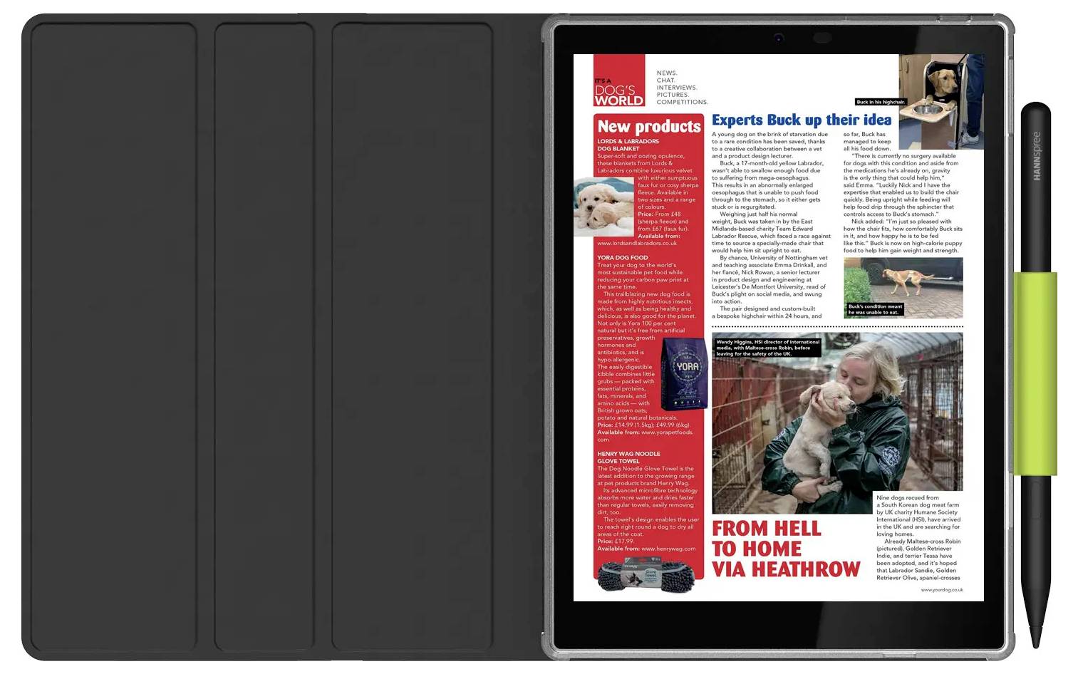 'Hondenwereld Magazine' getoond op een tablet met artikelen over nieuwe hondproducten en verhalen over herplaatsing, naast een afbeelding van een vrouw die een hond vasthoudt.