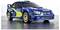 Een blauwe en groene Subaru rallywagen met 'Subaru' en sponsorlogo's aan de zijkanten, die een sportief ontwerp en gouden velgen laat zien.