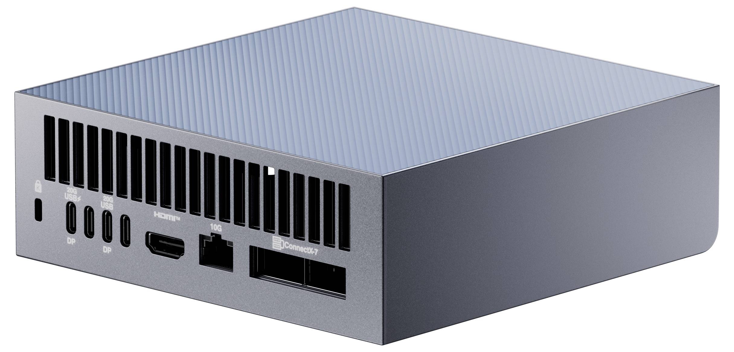 Een compacte, slanke computer met meerdere poorten aan de zijkant, waaronder USB-C, HDMI en Ethernet, die rust op een vlak oppervlak.