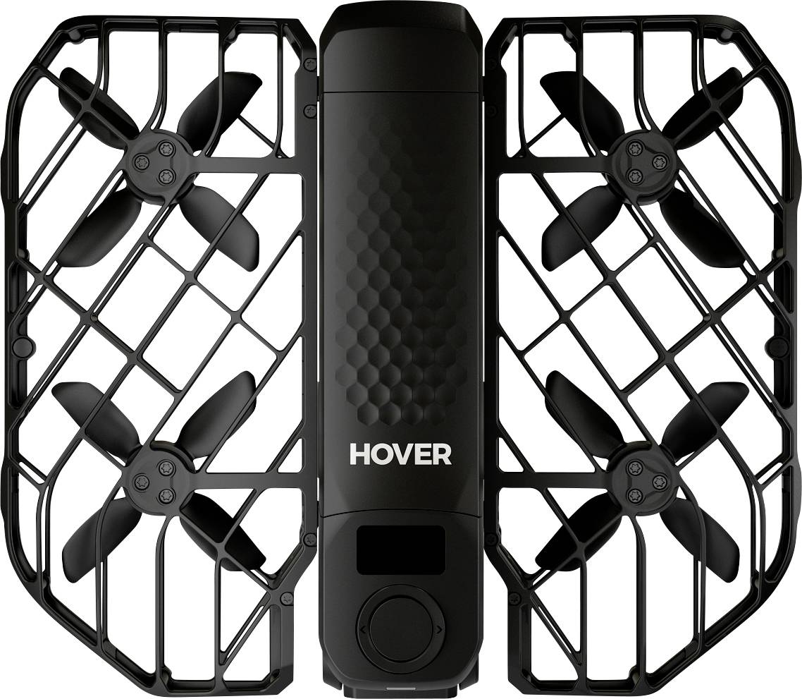 Een compacte zwarte drone met vier propellers in een beschermende behuizing, met het label 'HOVER' op de romp, gebruikt voor luchtfotografie.