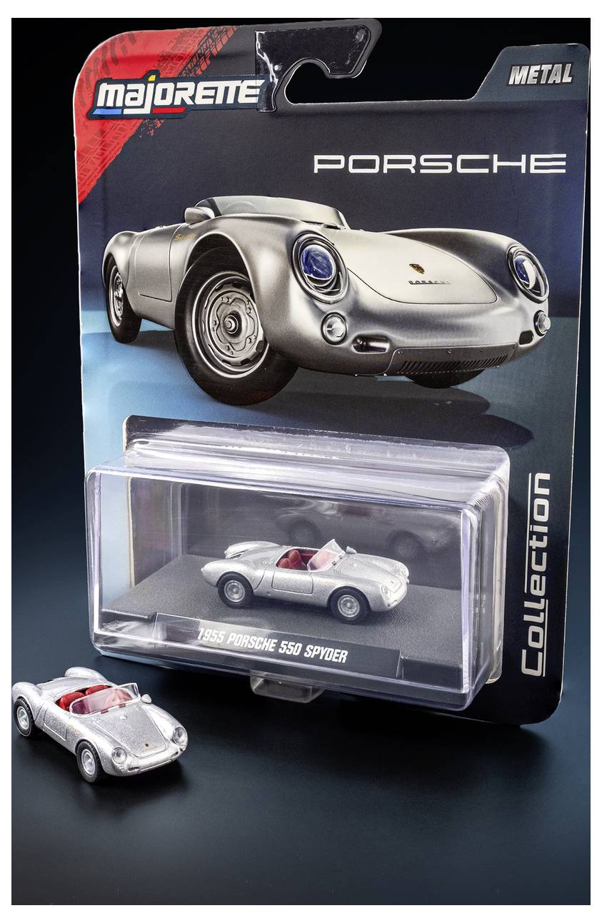 De afbeelding toont een Majorette speelgoedmodel van een '1955 Porsche 550 Spyder' in zilverkleur met de originele verpakking. Een kleine replica-auto is buiten de verpakking geplaatst.