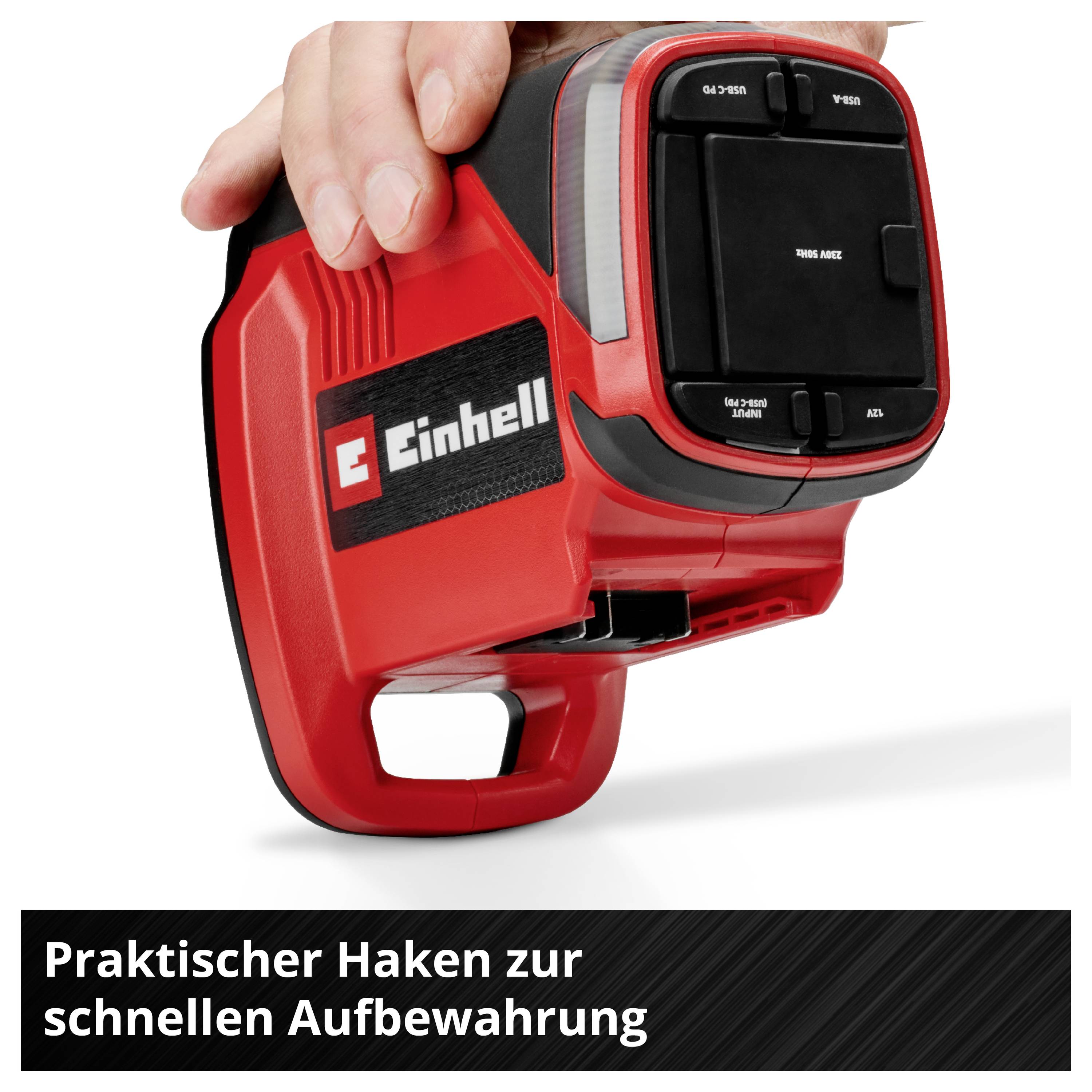 Een hand houdt een rode accu-compressor vast met het Einhell-logo. Eronder staat: 'Praktische haak voor snelle opslag'.