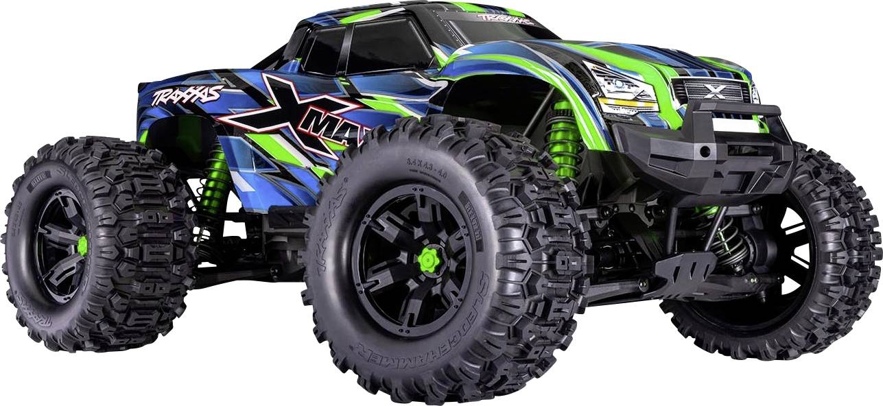 Een blauwe en groene afstandsbediende terreinwagen met monstertruckkenmerken, uitgerust met grote zwarte banden, speciaal ontworpen voor hoogpresterende rijomstandigheden op ruwe en oneffen ondergronden.