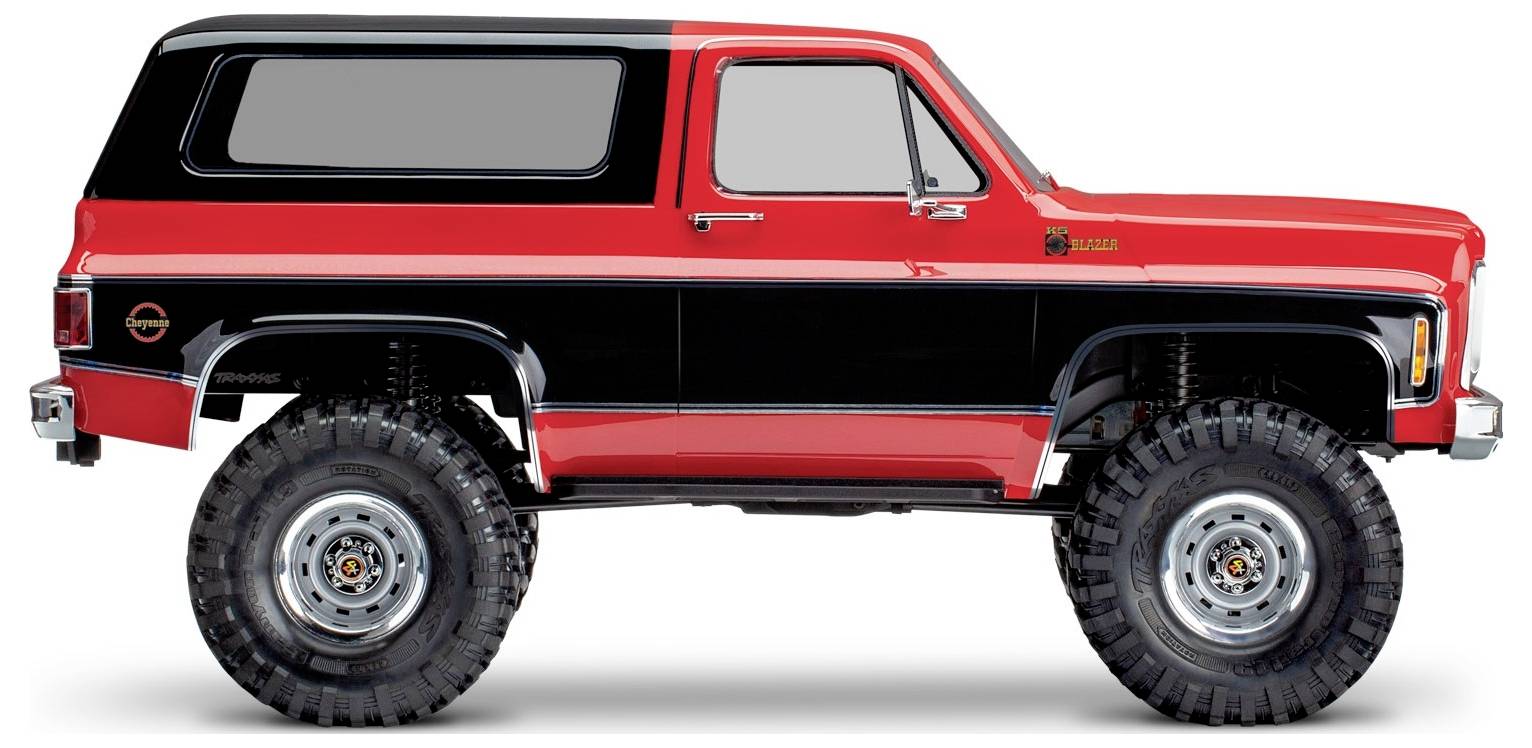 Rode en zwarte klassieke SUV, zijaanzicht, met grote terreinbanden en een retro-ontwerp.
