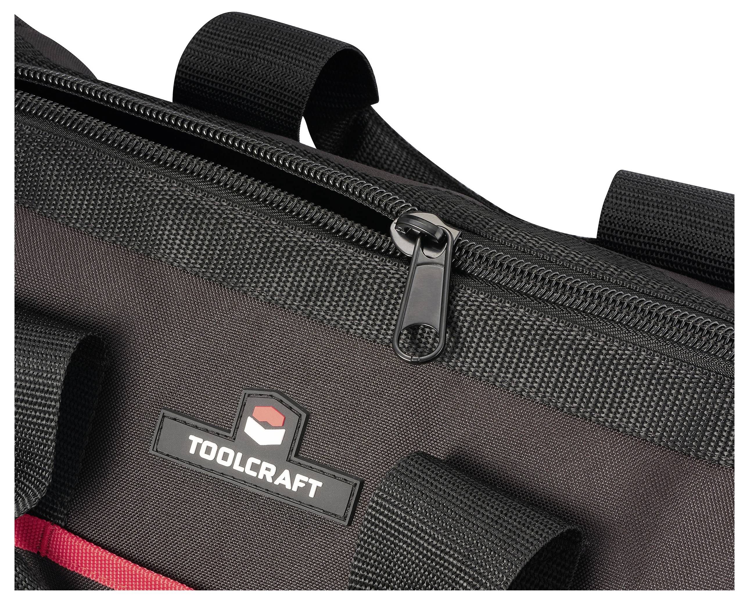 'TOOLCRAFT' gelegde gereedschapzak in zwart met een gedeeltelijk open rits, die degelijke constructie en rode accenten toont.