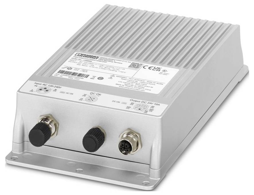 Een zilverkleurig elektronisch apparaat met twee zwarte connectoren en één ronde connector aan de voorkant, met verschillende technische labels op de bovenkant.